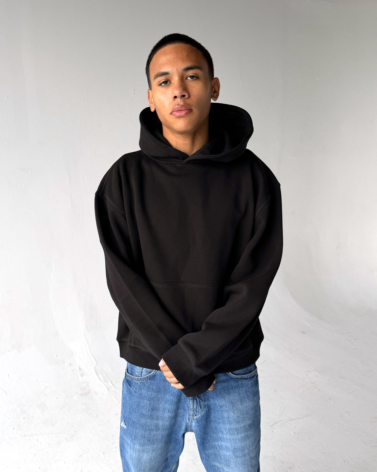 Brooklyn Classic pullover hoodie in Black, front, on a model