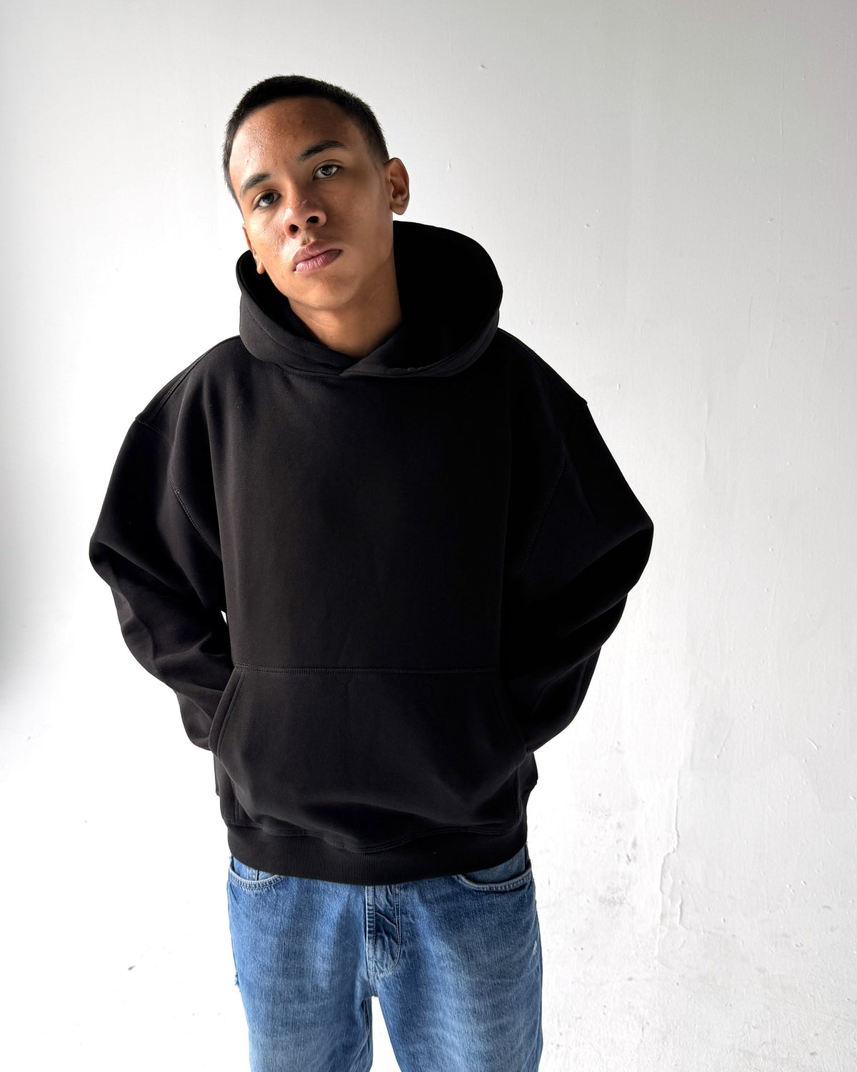 Brooklyn Classic pullover hoodie in Black, front, on a model