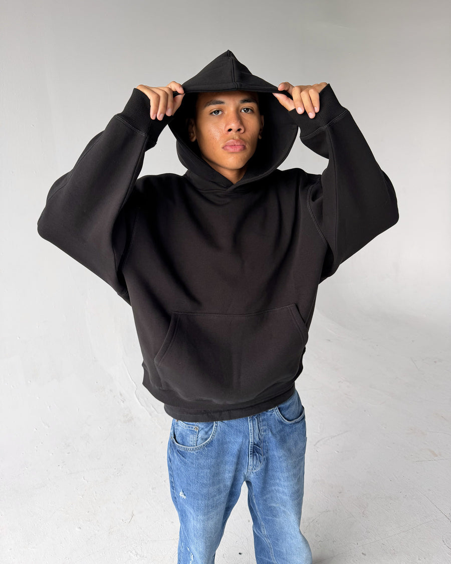 Brooklyn Classic pullover hoodie in Black, hood up, on a model