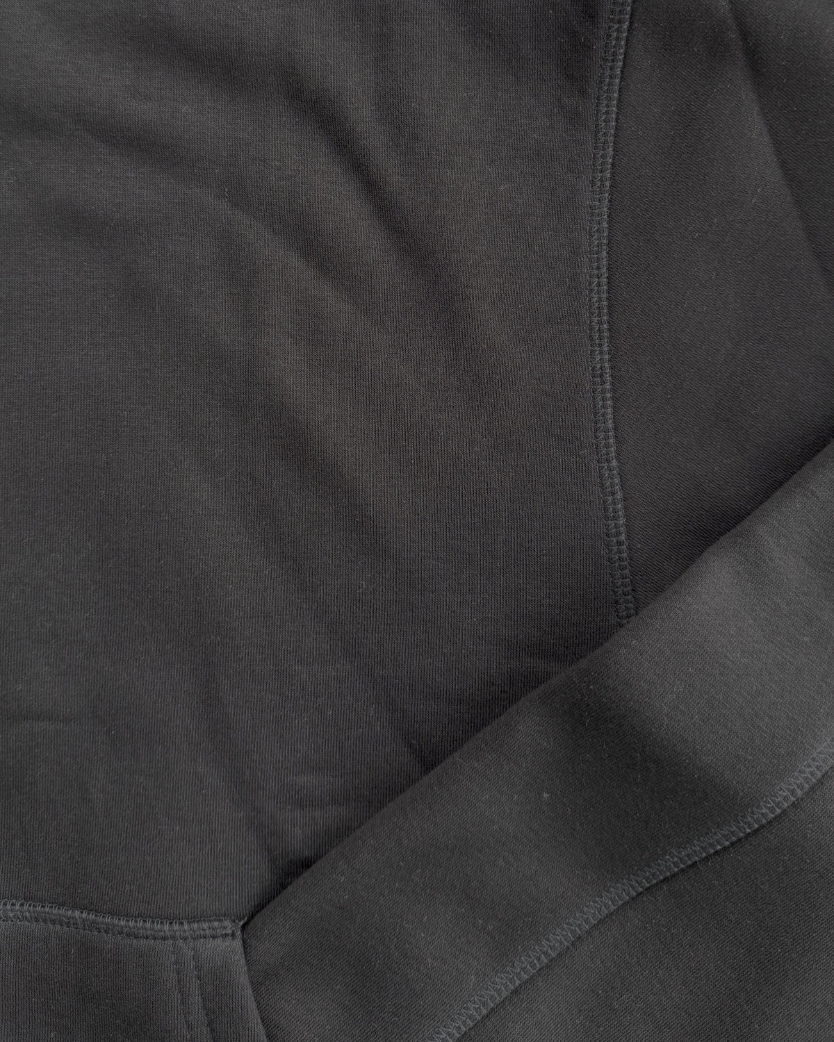 Brooklyn Classic pullover hoodie in Black, close-up of the shoulder seam