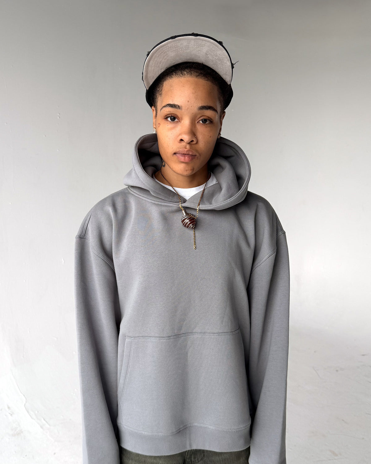 Brooklyn Classic pullover hoodie in Grey, front, on a model