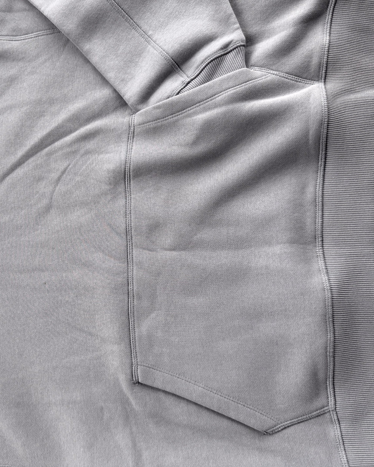 Brooklyn Classic pullover hoodie in Grey, close-up of the pocket