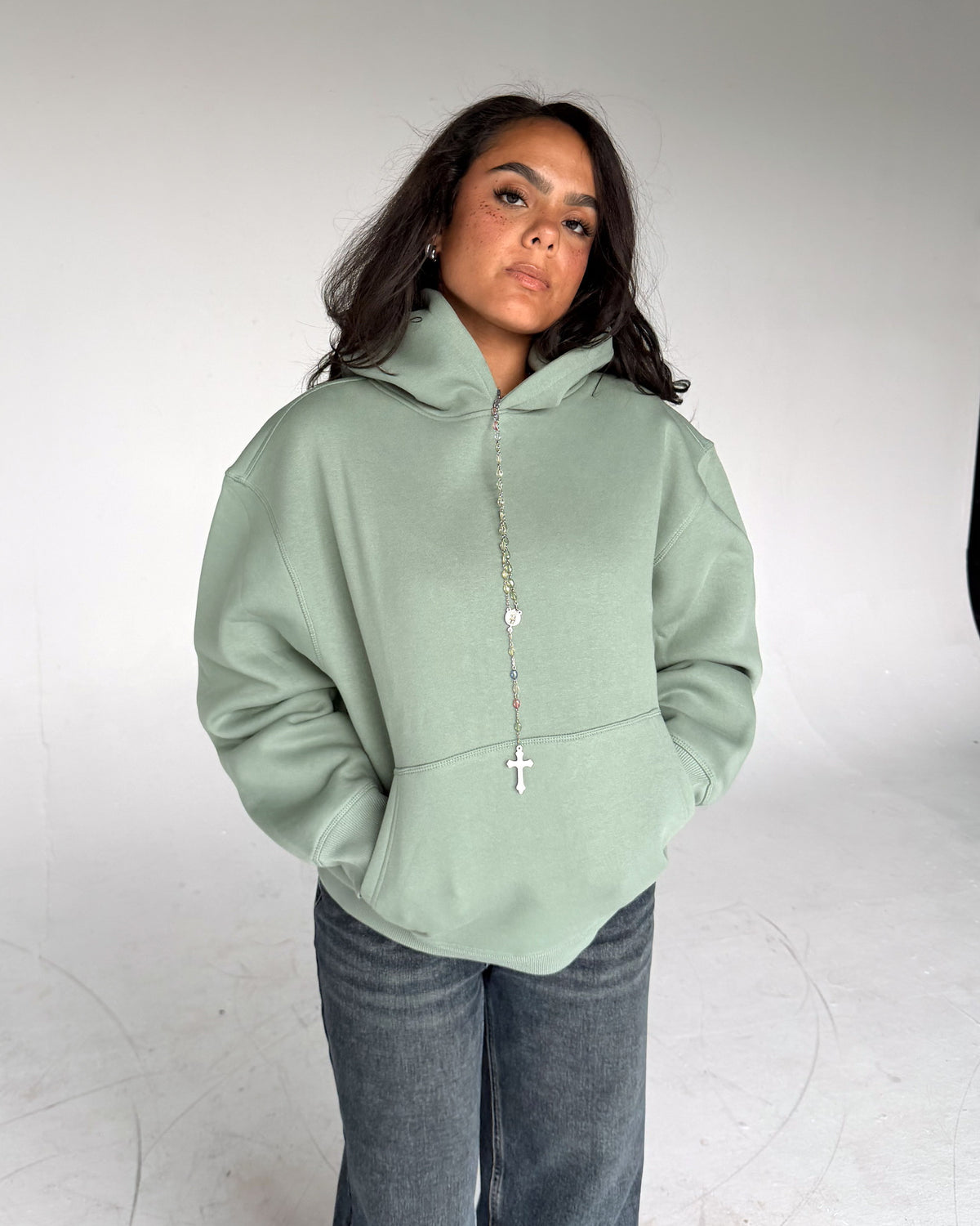 Brooklyn Classic pullover hoodie in Sage, front, on a model