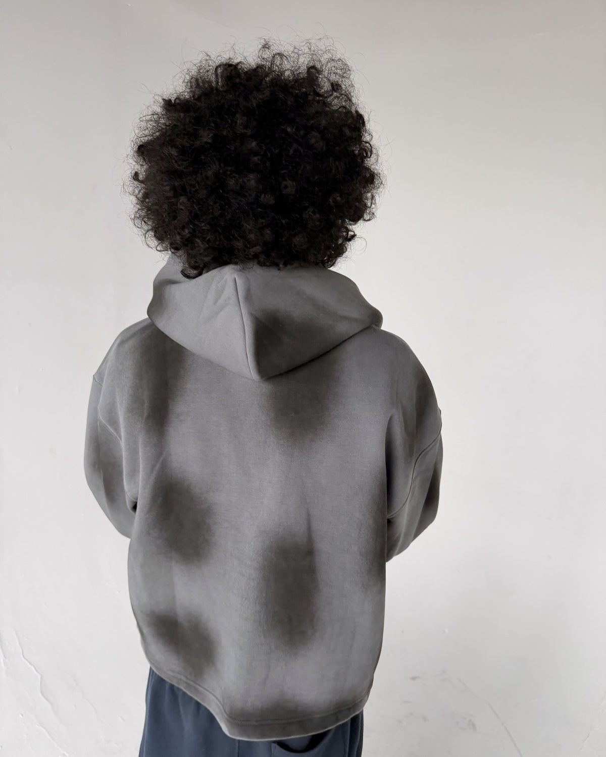 Uptown Crop cropped zip-up hoodie in Washed Grey, back, on a model